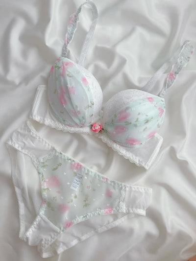 Floral lingerie set on a white fabric background