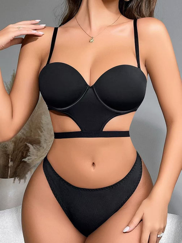 Black bikini set worn by a model on a neutral background